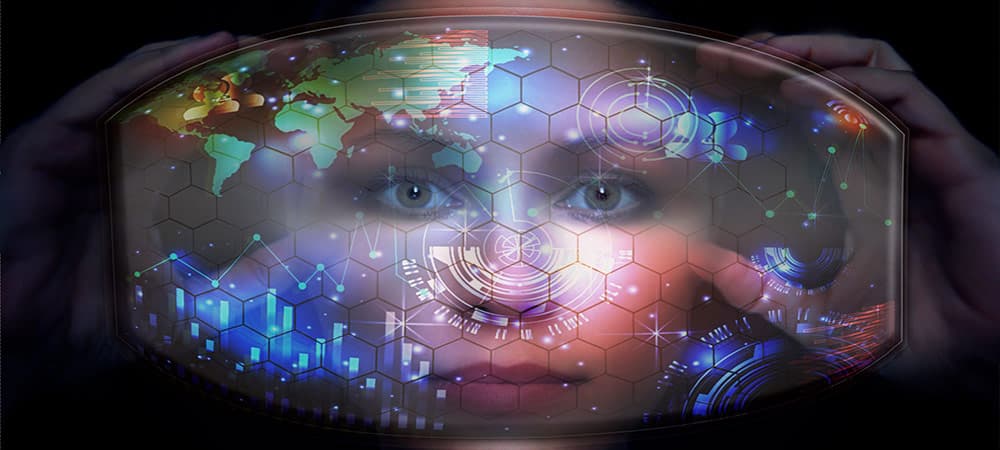 Close-up portrait of young and beautiful woman with the virtual futuristic glasses ( technology concept).Virtual holographic interface and young woman wearing glasses